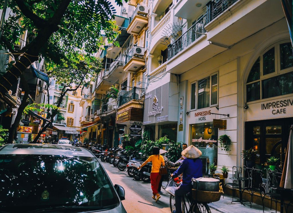 people walking in front of buildings